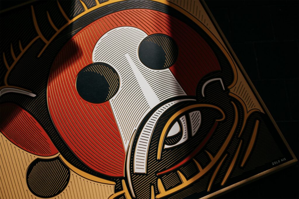 Tukumora by Zolo Kis — angled close-up of the red and white face and circular black eyes