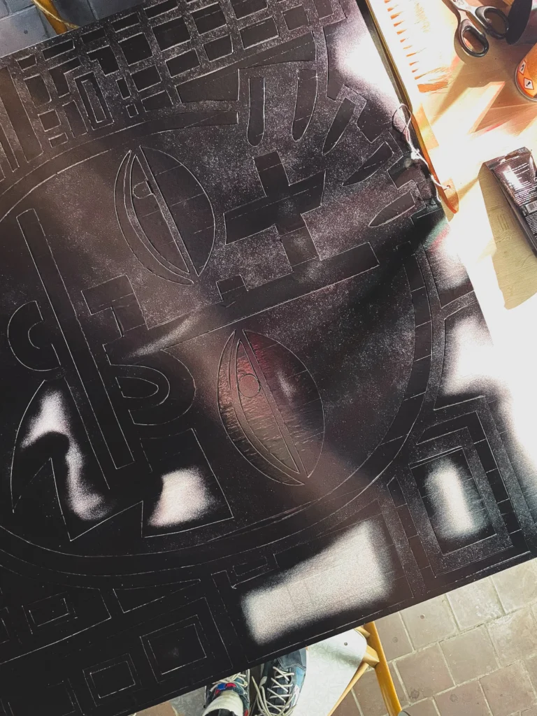Butt Boy by Zolo Kis — black paint being applied over the milled panel