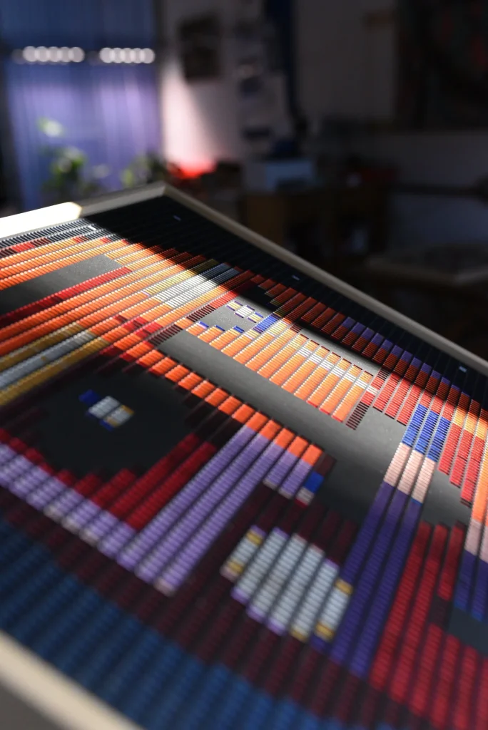 Starboy edition S by Zolo Kis — shallow-focus view across the colourful face on the studio table