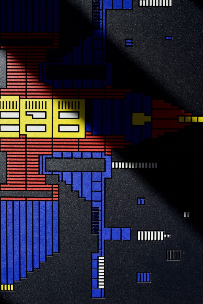 Zolo Kis artwork — close-up of yellow windows and blue and red ridged shapes