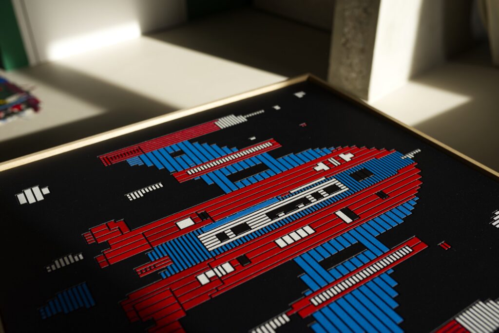 Zolo Kis artwork — angled view of red and blue spacecraft forms on the black panel