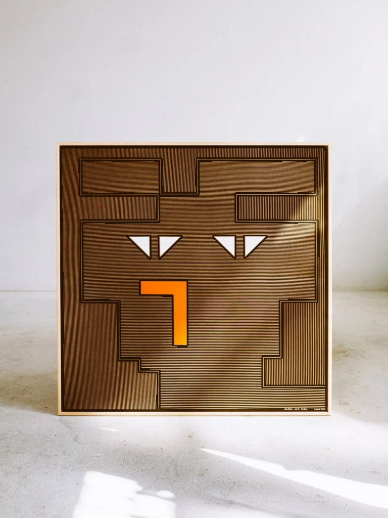 Alpha Cat - Rišo by Zolo Kis — framed brown cat face with white triangular eyes and an orange nose