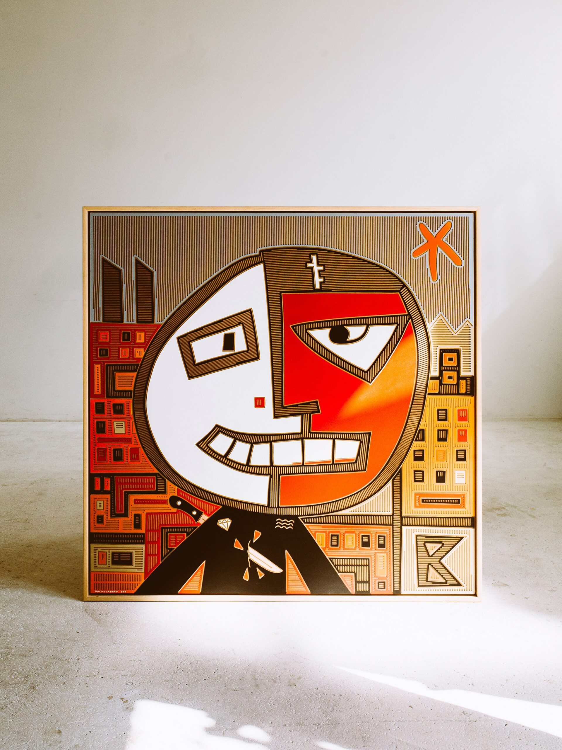 Backstabbed Boy by Zolo Kis — framed face split into red and white halves with an orange patterned background