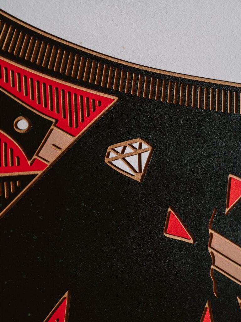 Backstabbed Boy by Zolo Kis — close-up of a diamond motif and red shapes on black