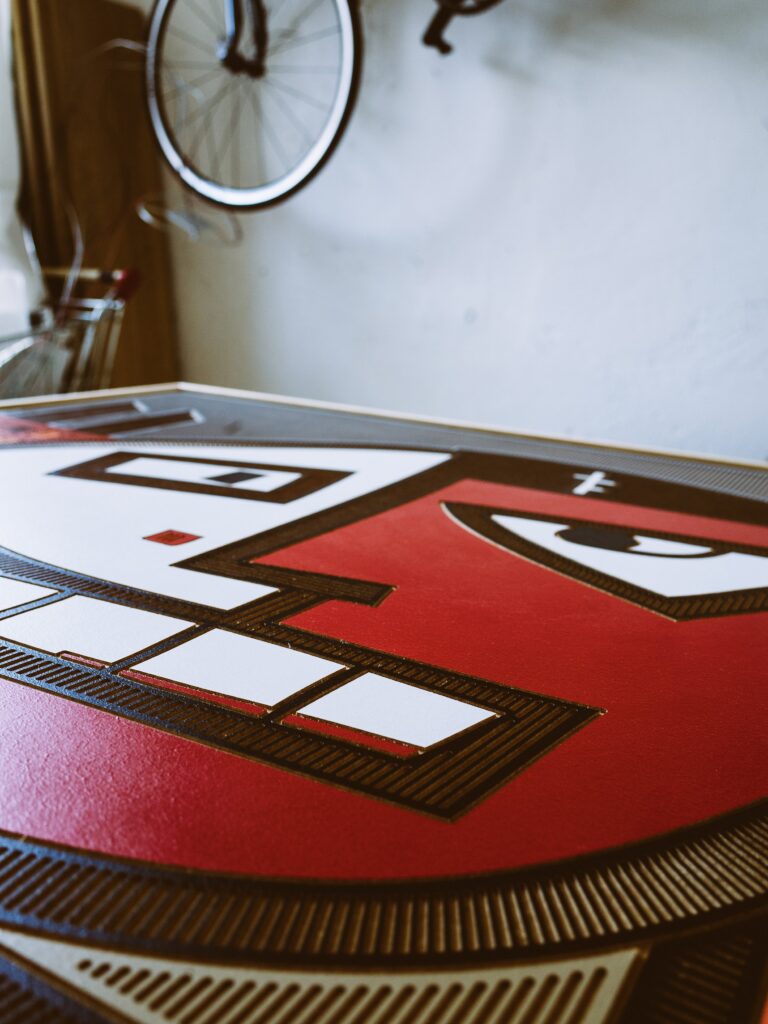 Backstabbed Boy by Zolo Kis — low-angle close-up across the red and white face in the studio