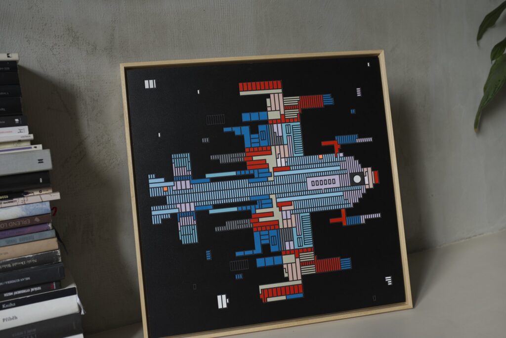 Zolo Kis artwork — framed blue and orange spacecraft leaning against a wall beside books