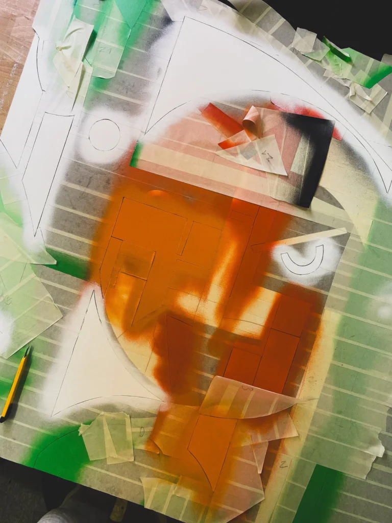 Oldschooler by Zolo Kis — orange paint being applied to a masked area of the face