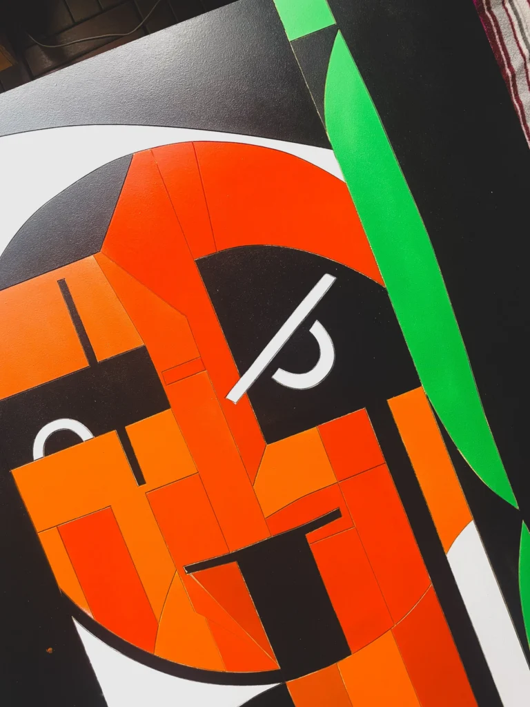 Oldschooler by Zolo Kis — close-up of the orange face and green shapes during painting